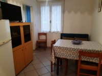 soggiorno con angolo cottura